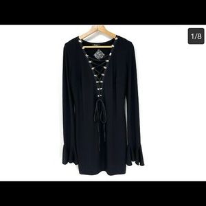 Long sleeve black mini dress with bell sleeves. Never been worn